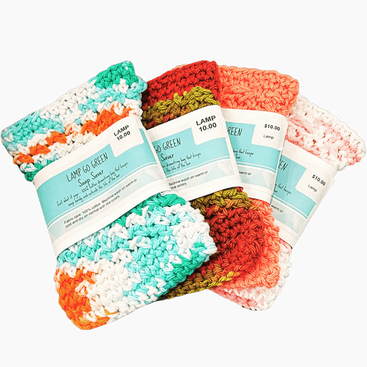 Colorful crocheted lamp soap pouch with price tags on a black background