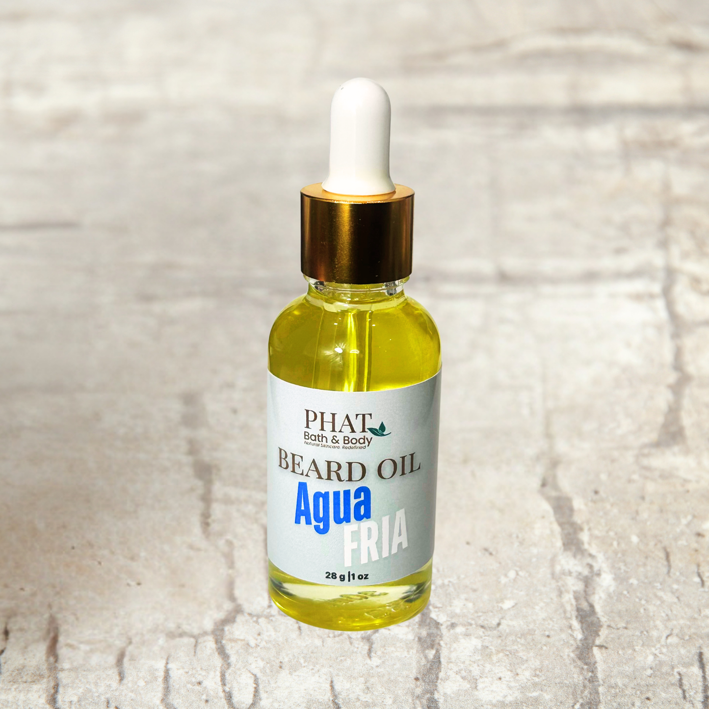 Bottle of Phat Bath & Body beard oil on a textured beige background
