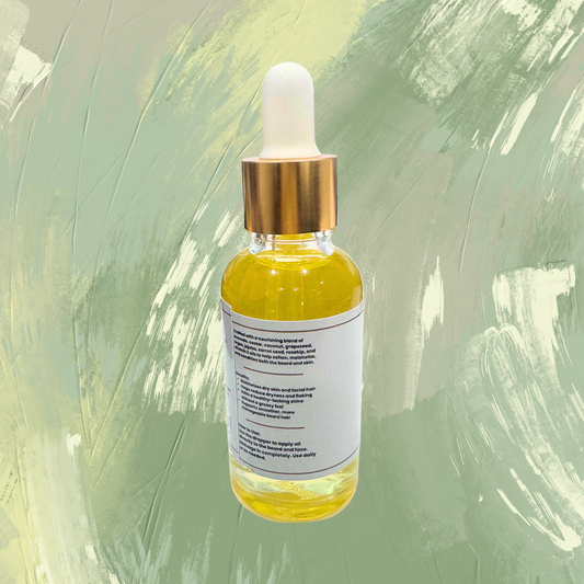Clear bottle with a gold cap on a green textured background