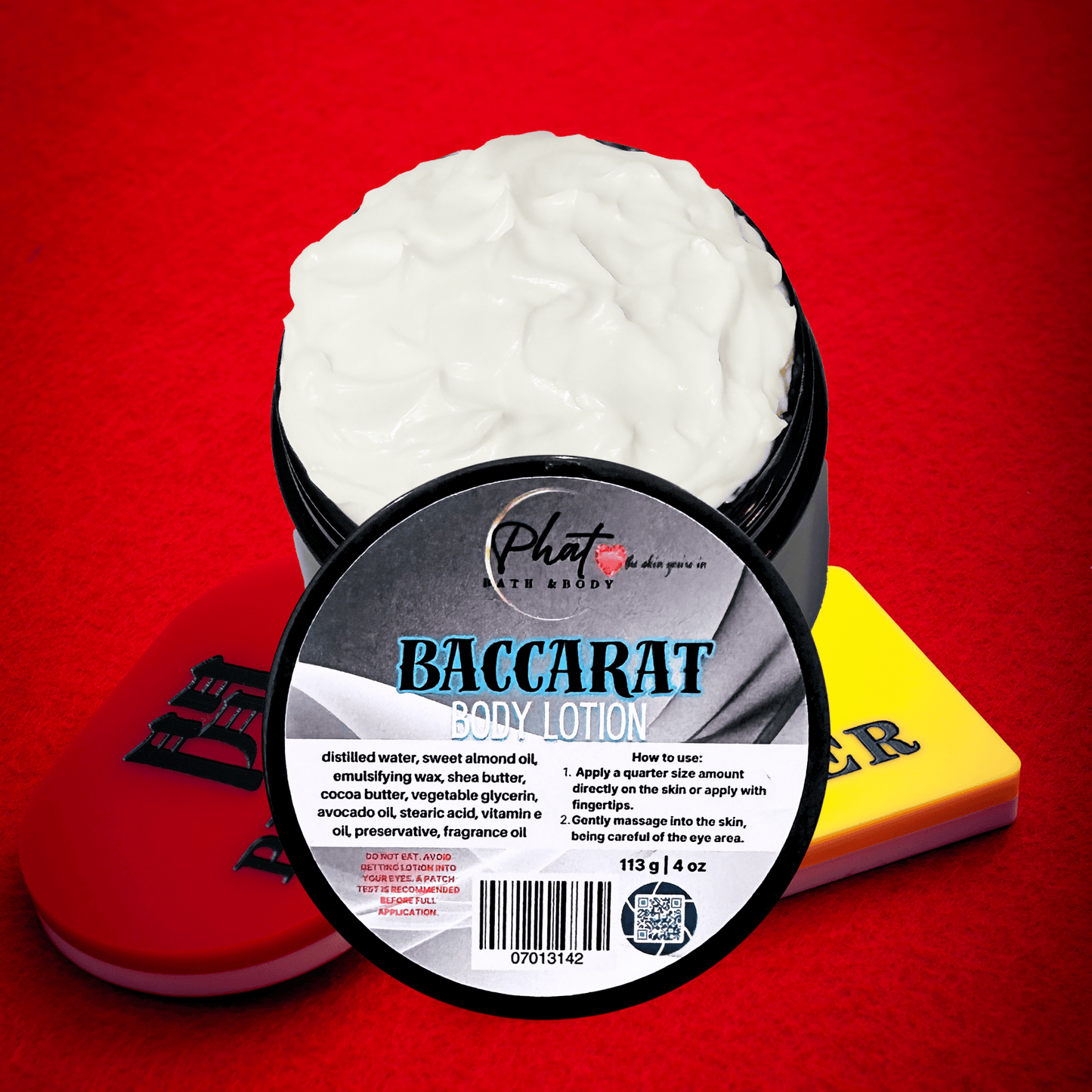 Baccarat body lotion container with a red background