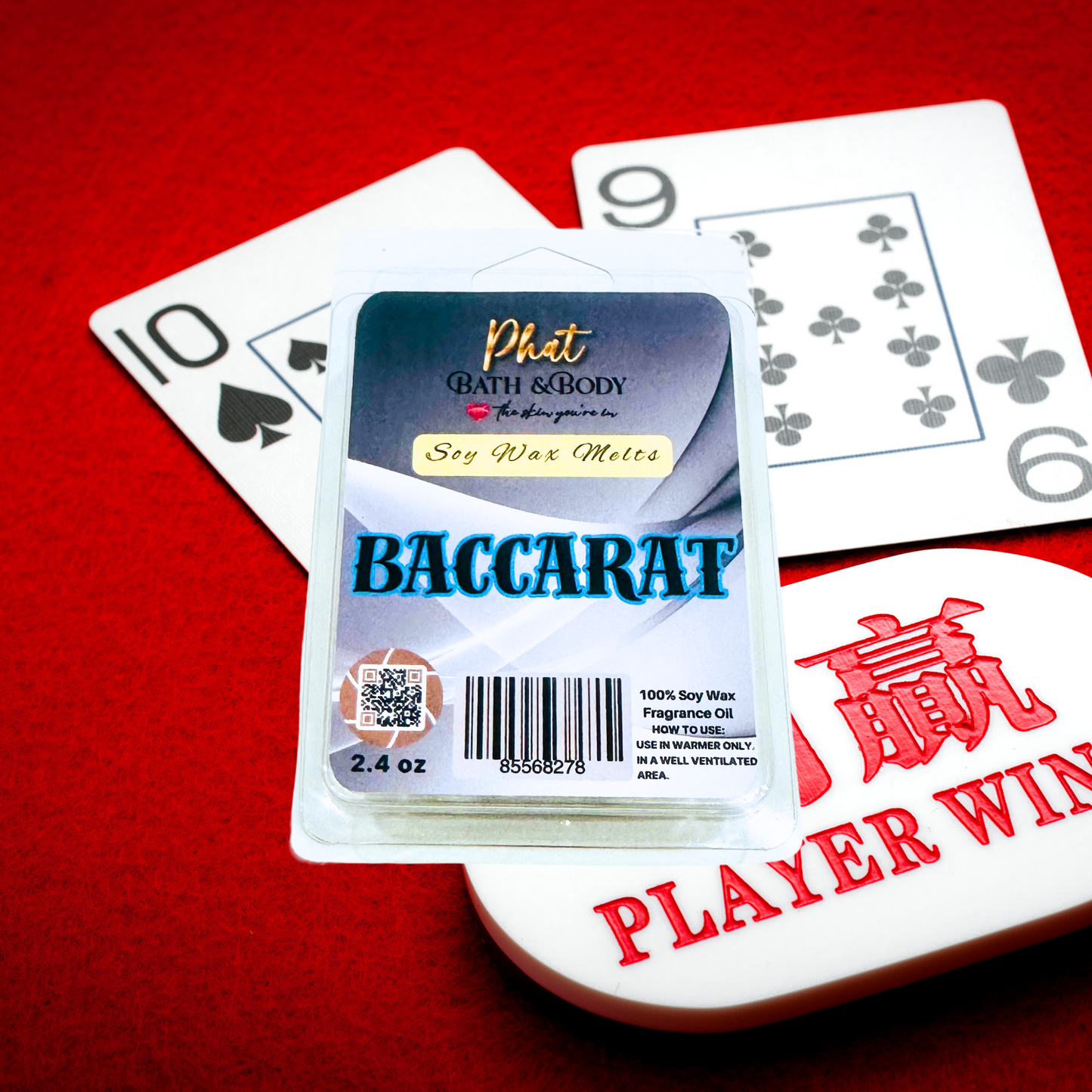 Baccarat wax melt packaging with playing cards on a red background