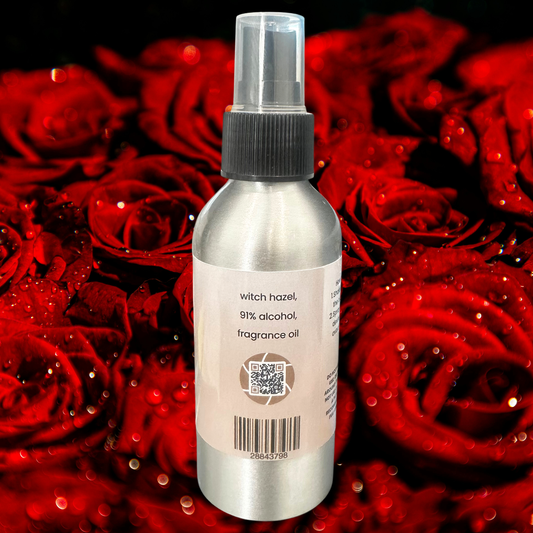 Bottle of body spray on a background of red roses.
