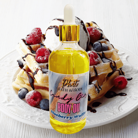 Bottle of body oil with a label on a plate of waffles with berries