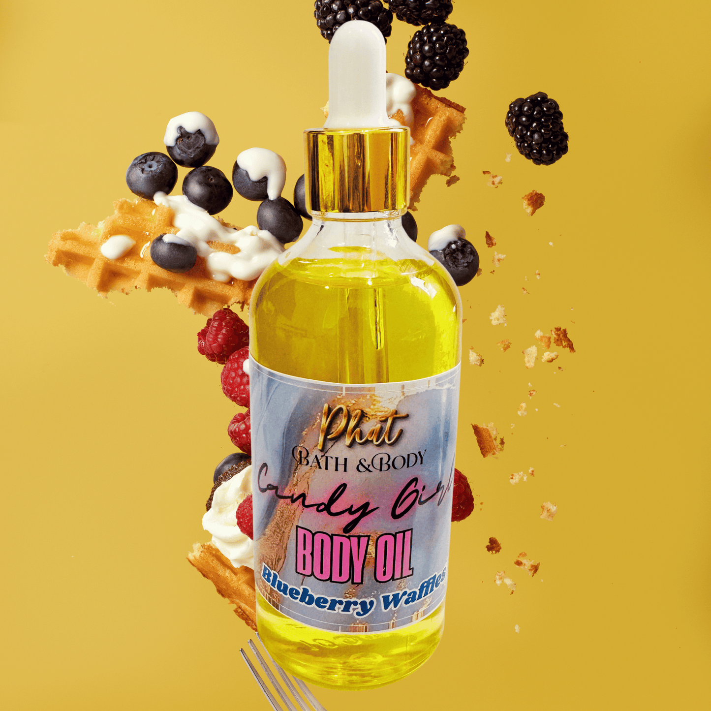 Bottle of 'Phat Bath & Body Candy Girl' body oil with waffle, berries, and blackberries on a yellow background