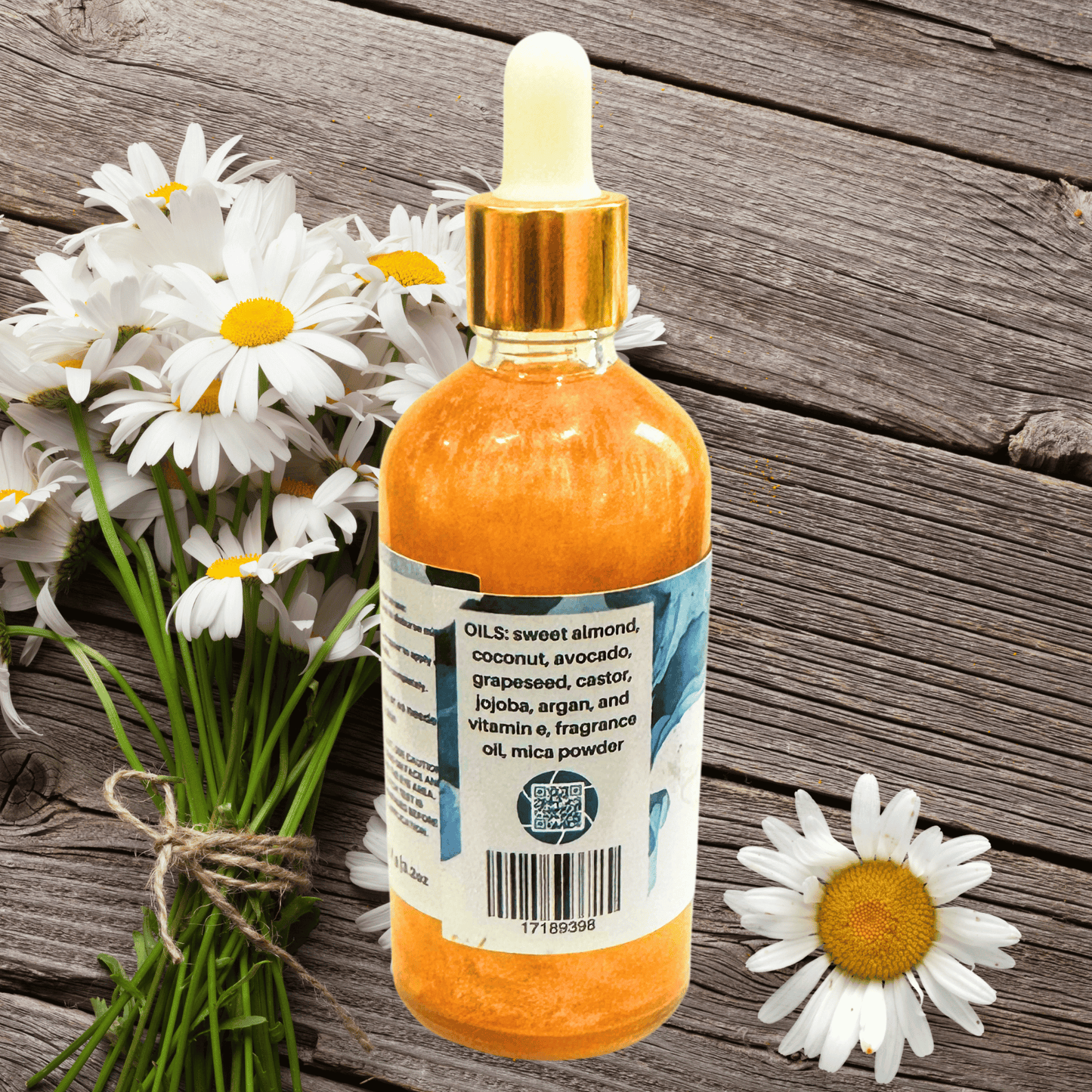 Bottle of shimmering body oil with dropper on a wooden surface with daisies