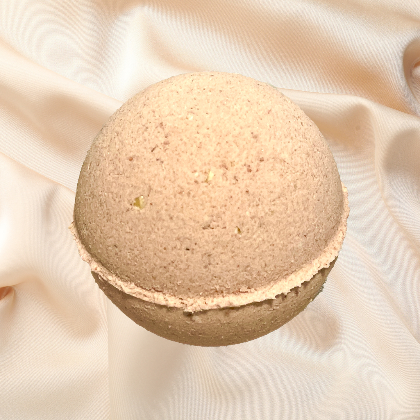 Bath bomb on a soft beige fabric background