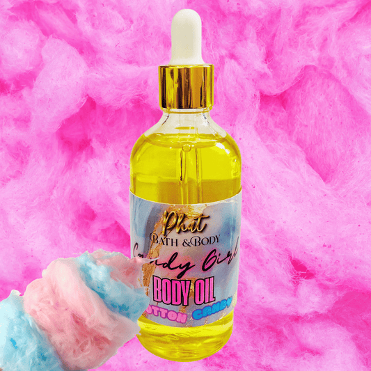 Bottle of body oil with a dropper on a pink cotton candy background