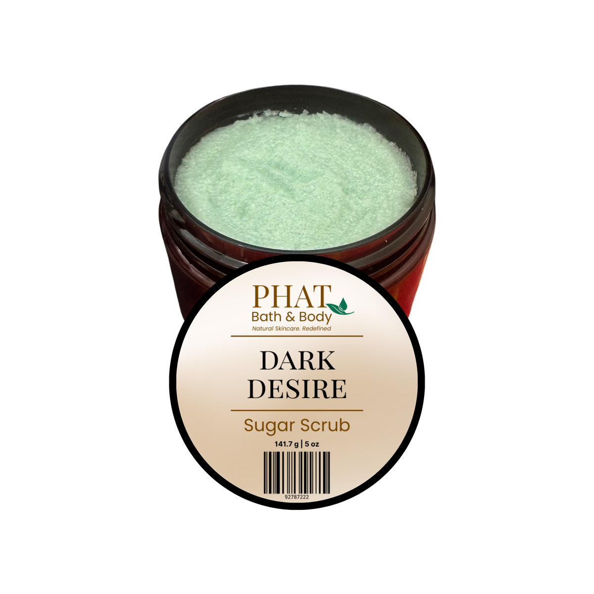 An open amber jar of PHAT Bath & Body 'Dark Desire' sugar scrub, showing the pale mint-green scrub inside, with a round product label in front on a plain white background.
