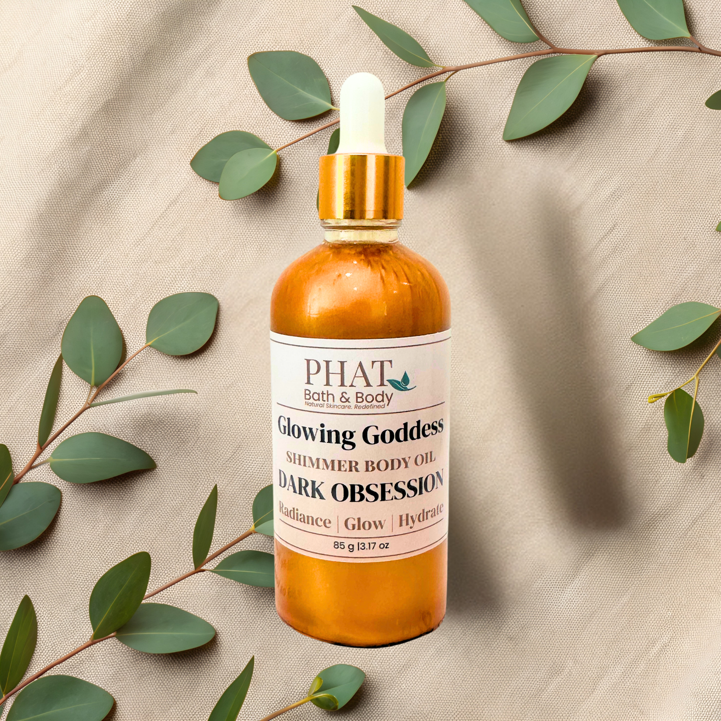 Bottle of 'Dark Obsession' by Phat Bath & Body on a beige fabric background with green leaves.