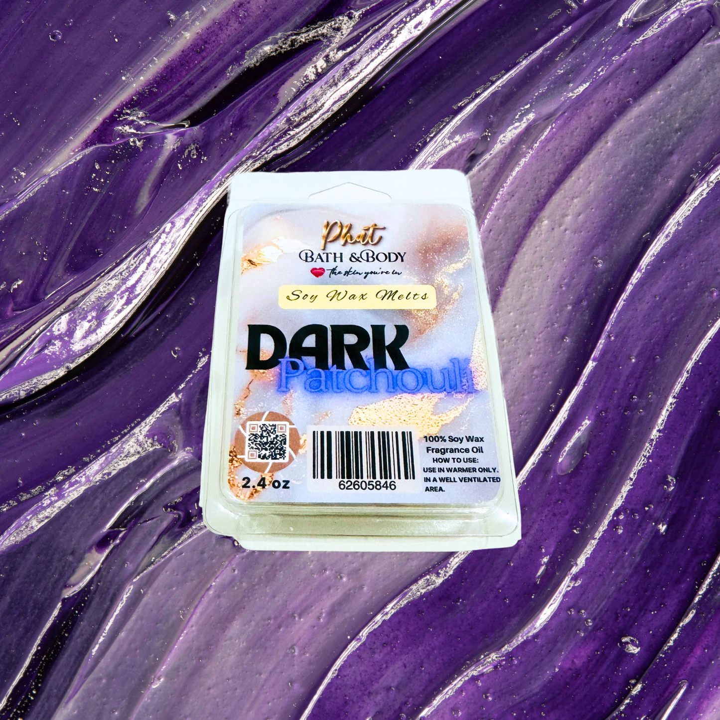 Phat Bath & Body Dark Patchouli wax melt on a purple textured background