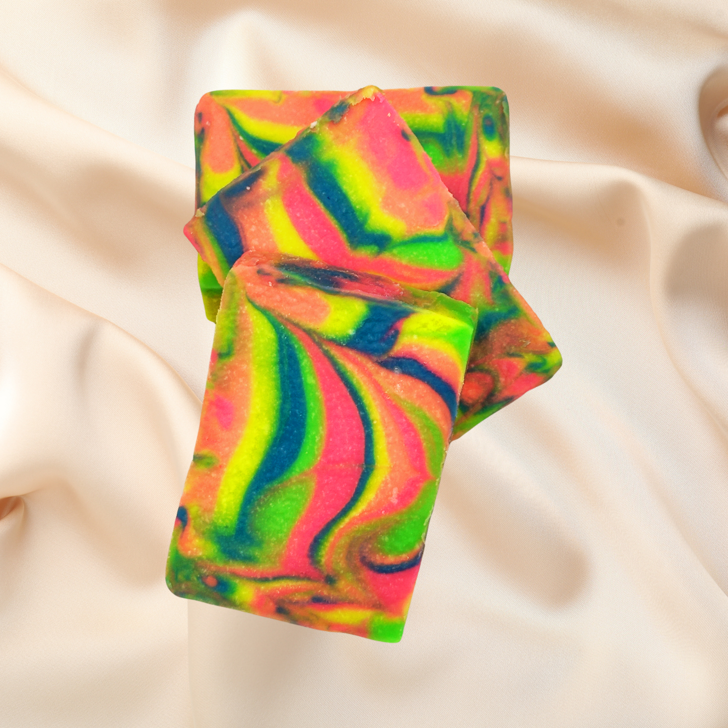 Colorful swirled soap bar on a beige fabric background