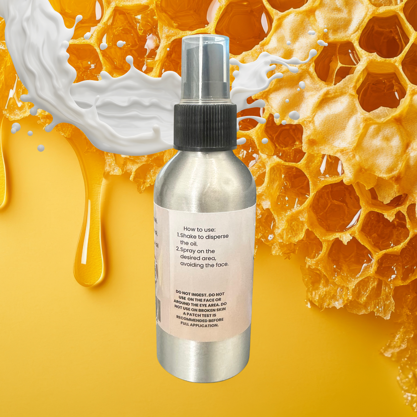 Silver spray bottle with honeycomb and honey background