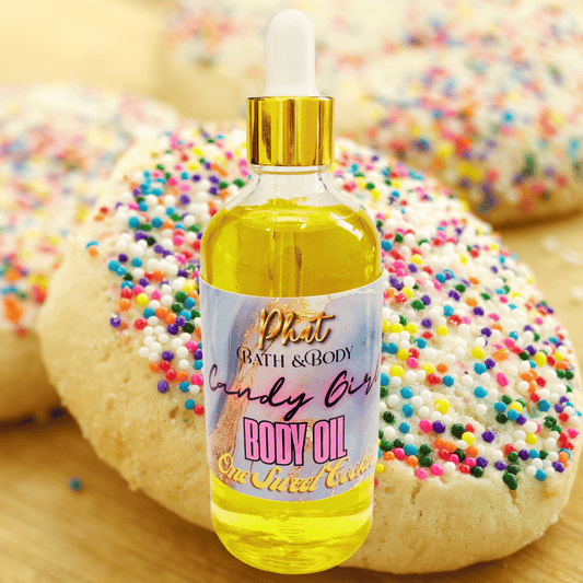 Bottle of body oil with a colorful label in front of cookies with sprinkles
