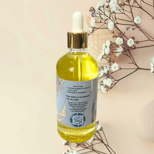 Bottle of yellow liquid with dropper on a beige background with white flowers