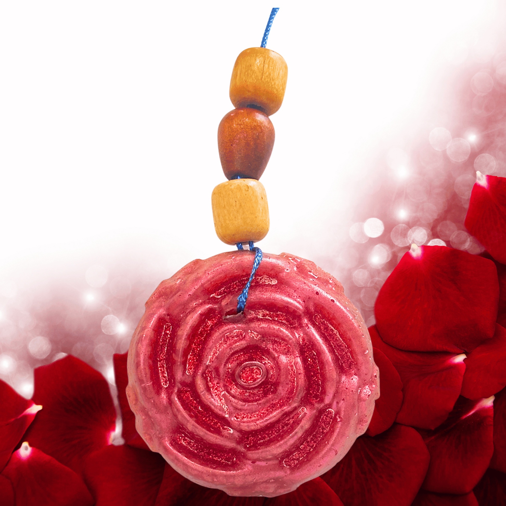Decorative rose shape car freshie with wooden beads and a pink circular design on red floral background