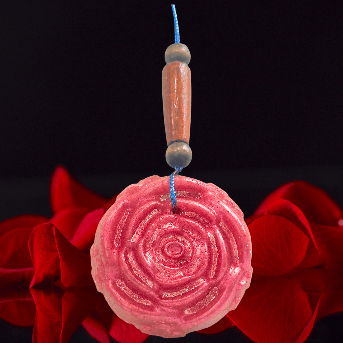 red rose shaped car freshie with roses on a black background