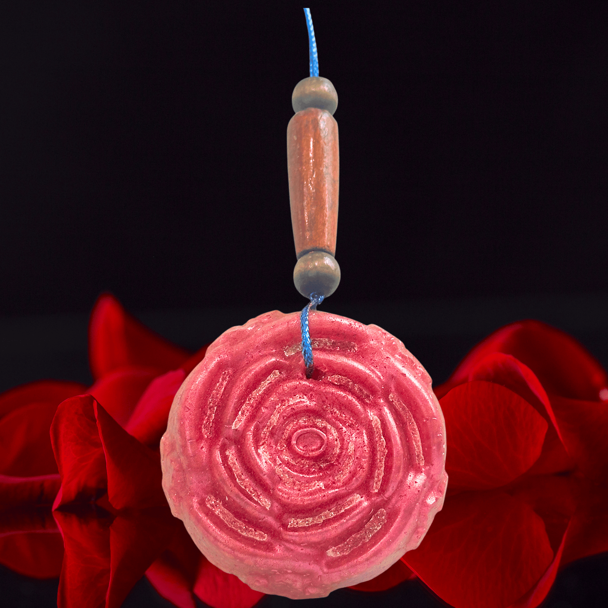 red rose shaped car freshie with roses on a black background