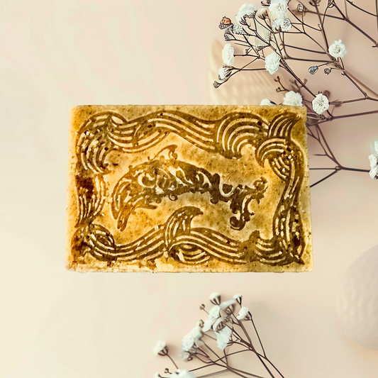 Decorative soap bar with intricate design on a light background