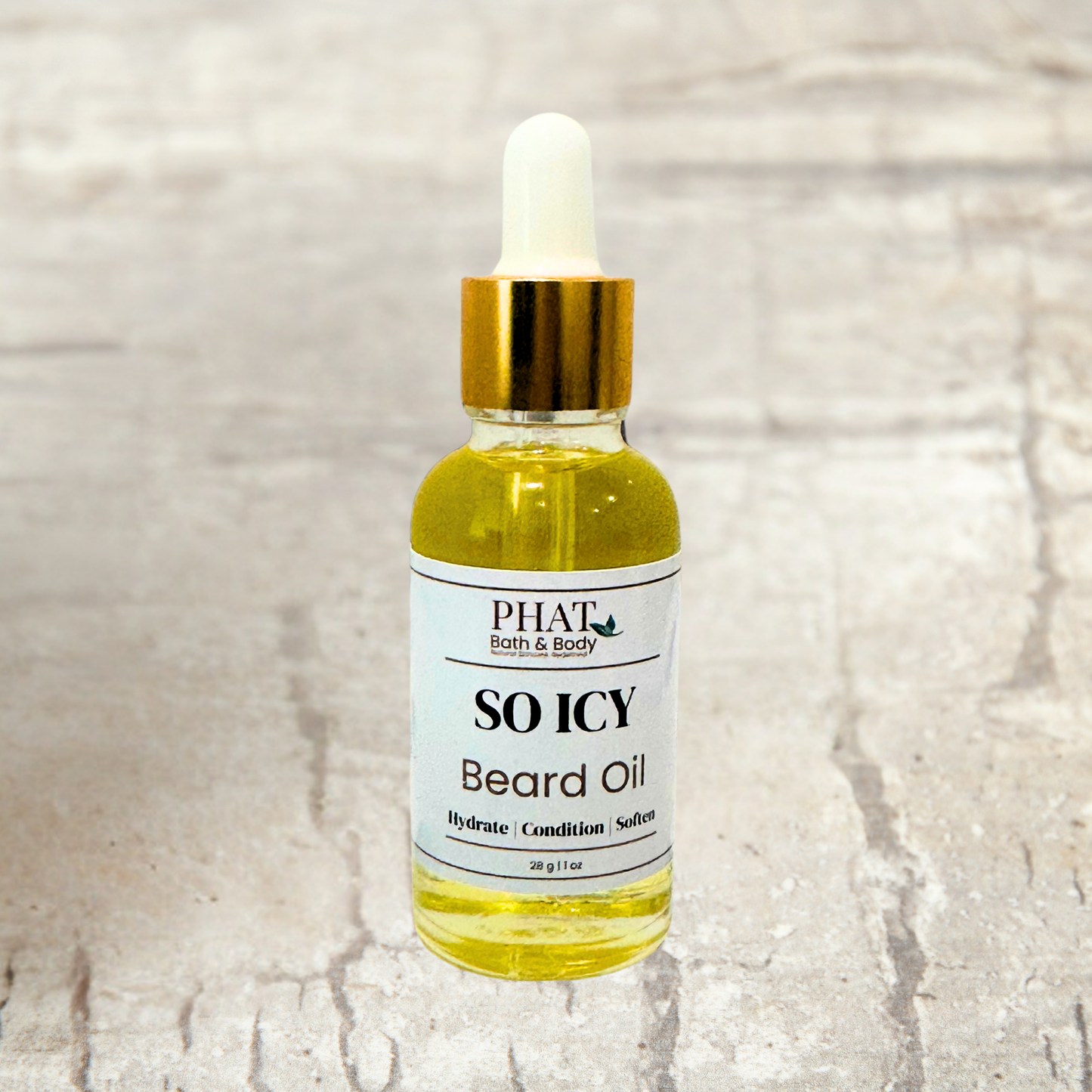 Bottle of PHAT Bath & Body Beard Oil So Icy on a stone background