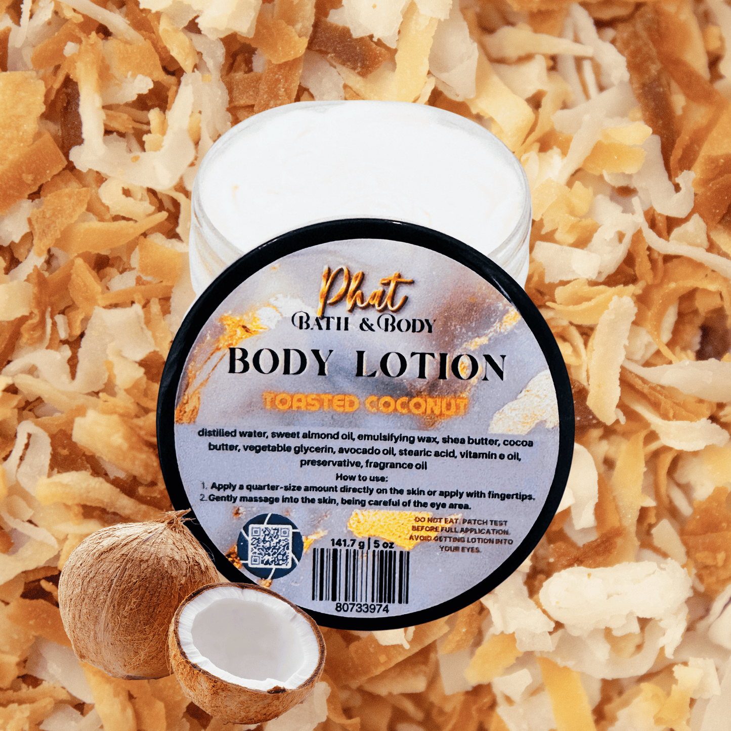 Body lotion container labeled 'Toasted Coconut' on a background of coconut shreds and pieces.