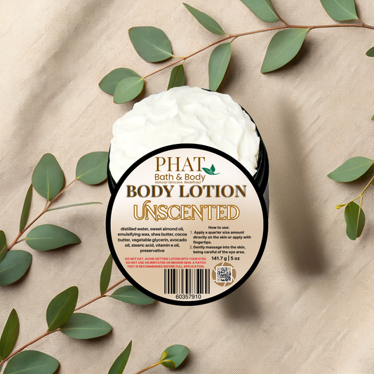 Body lotion container labeled 'Unscented' by Phat Bath & Body on a beige fabric background with green leaves.