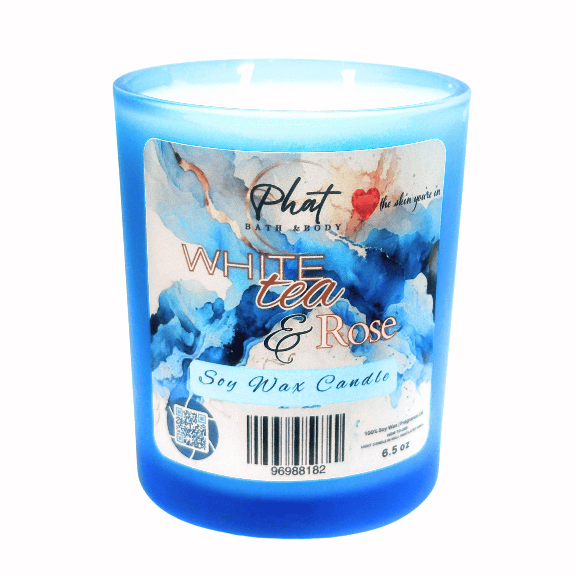 Blue candle with a label for 'White Tea & Rose' by Phat Bath & Body on a white background