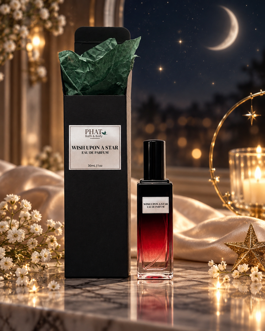 Wish Upon a Star women’s Eau de Parfum bottle with black gift box and green tissue in a luxury celestial setting.