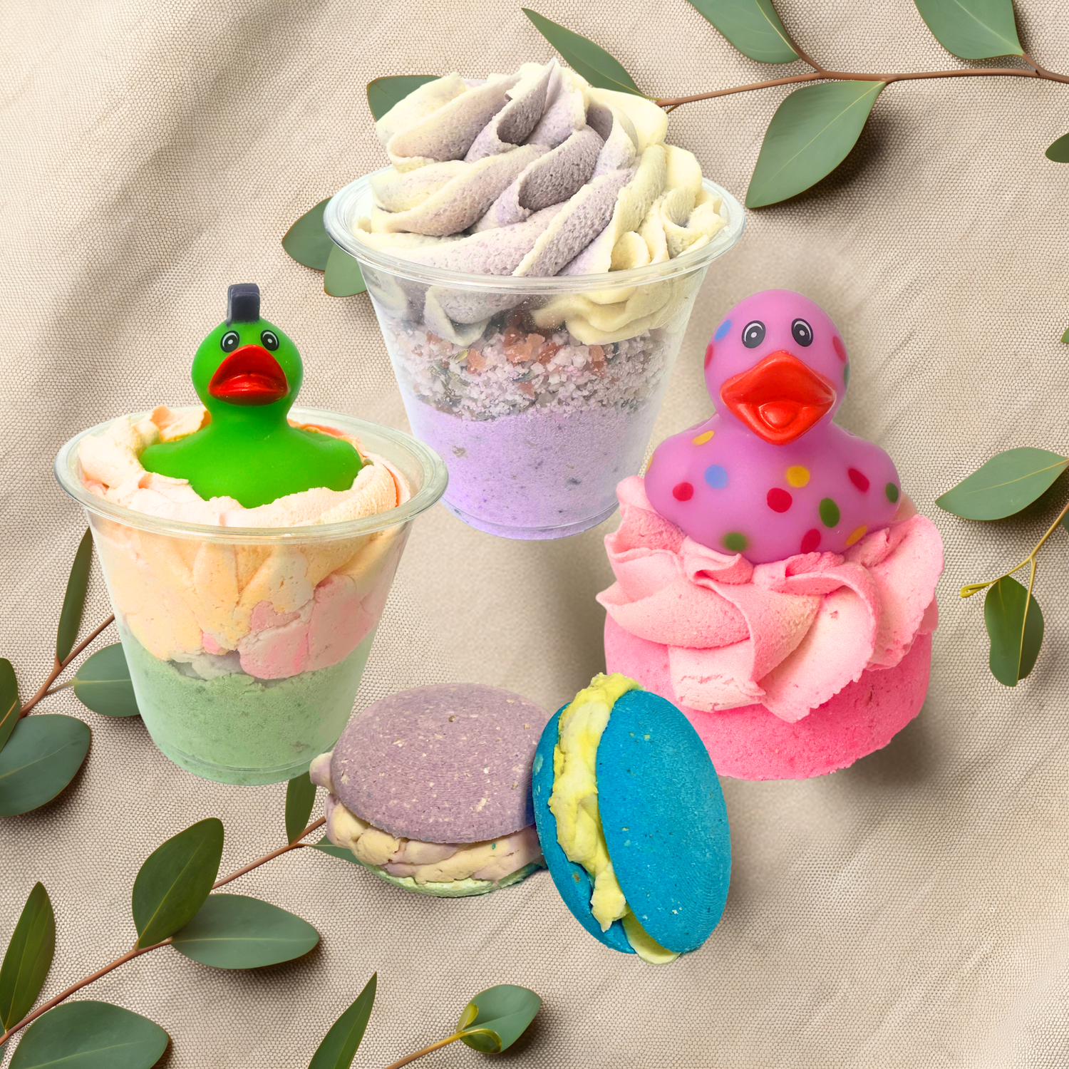 Colorful bubble bombs with duck-shaped toppers on a beige fabric background