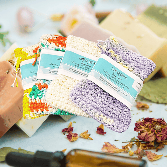 Colorful soap bars with decorative toppings and visible branding on a light surface.
