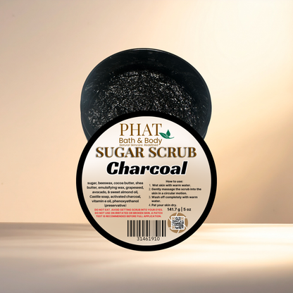 Jar of charcoal sugar scrub with 'Phat Bath & Body' label on a beige background