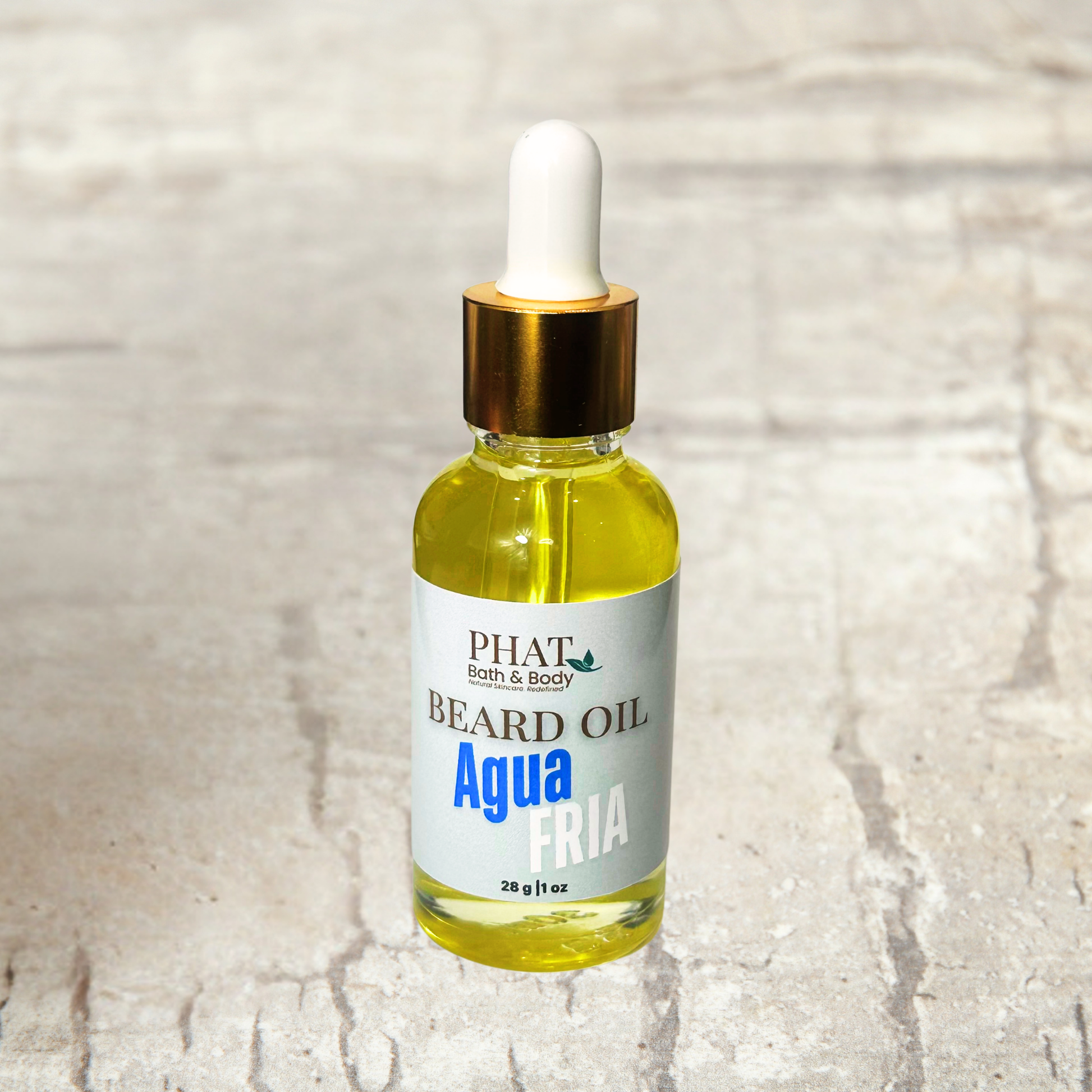 Bottle of Phat Bath & Body beard oil on a textured beige background