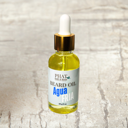 Bottle of Phat Bath & Body beard oil on a textured beige background