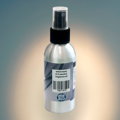 Bottle of body spray with a label on a gradient background