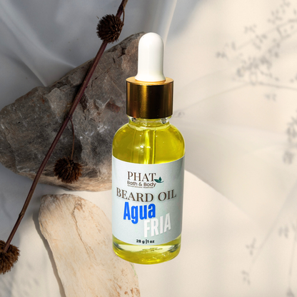 Bottle of Phat Bath & Body beard oil with a dropper on a neutral background