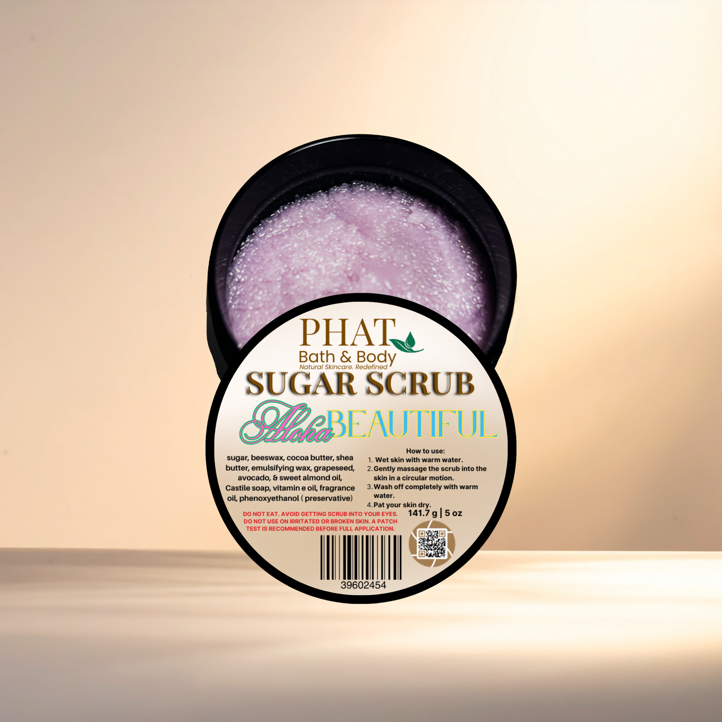 Phat Bath & Body sugar scrub container with visible label on a beige background