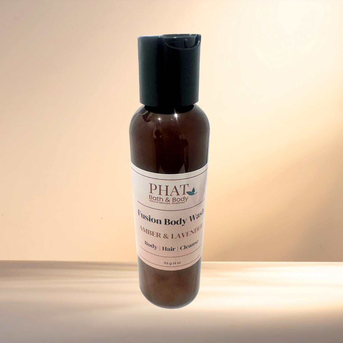 Bottle of PHAT Bath & Body Fusion Body Wash with a label on a gradient background