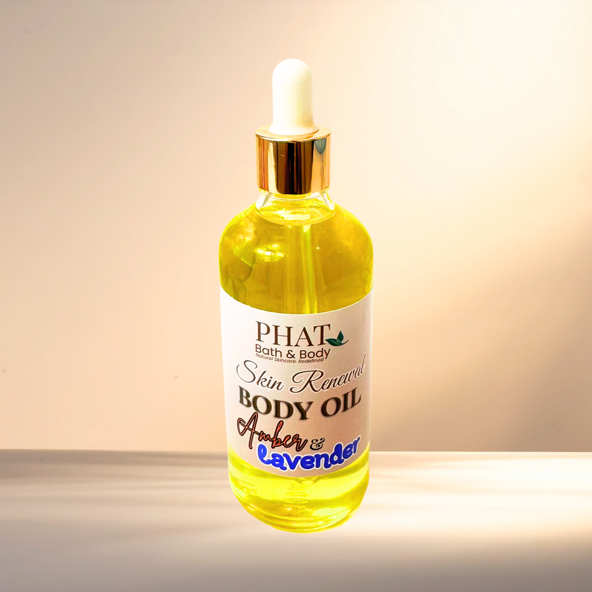 Bottle of PHAT Bath & Body skin renewal body oil with a dropper on a gradient background