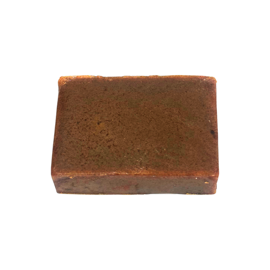 Rectangular brown bar of soap on a white background