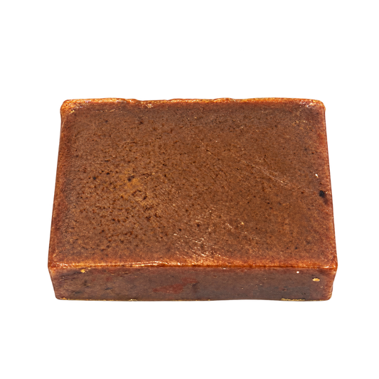Phat Bath & Body Ayurveda handmade bar soap featuring a rectangular, earthy brown bar with a naturally textured surface, shown on a transparent background for a clear view of the product.