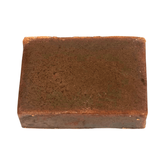 Rectangular brown bar of soap on a white background