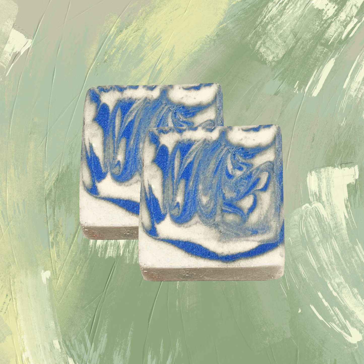 Two bars of soap with blue and white swirls on a green textured background