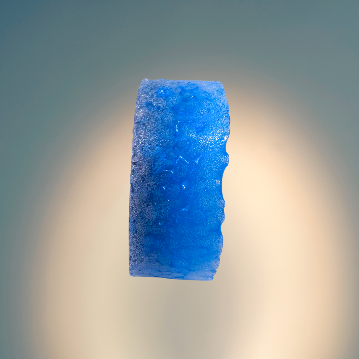 Blue textured freshie against a gradient background