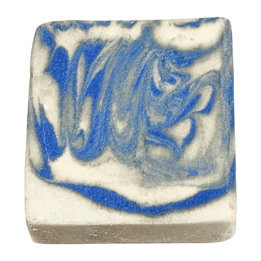 Square bar of soap with blue and gray swirl pattern on a white background