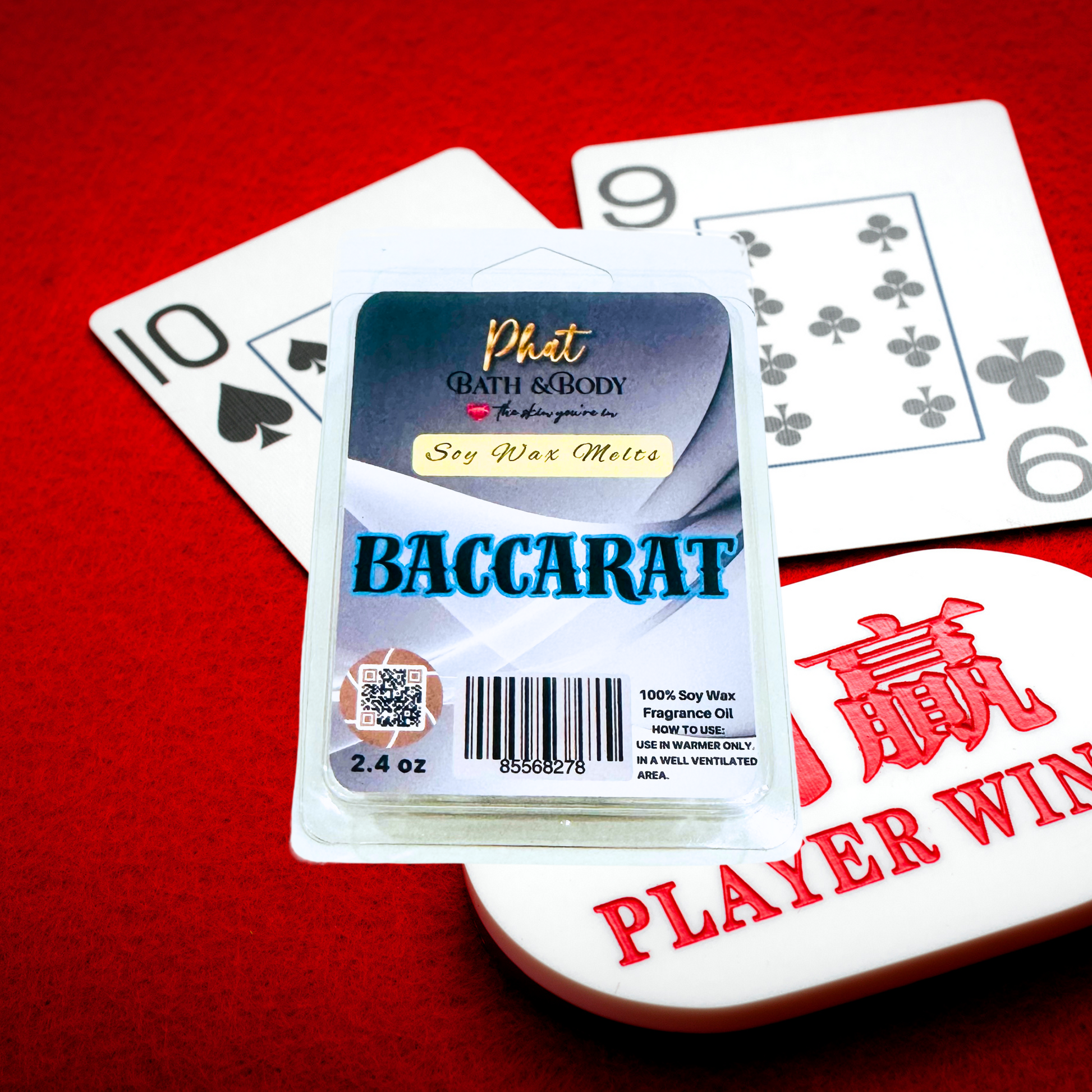 Baccarat wax melt packaging with playing cards on a red background