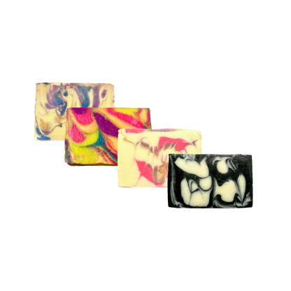 Four colorful soap bars on a white background