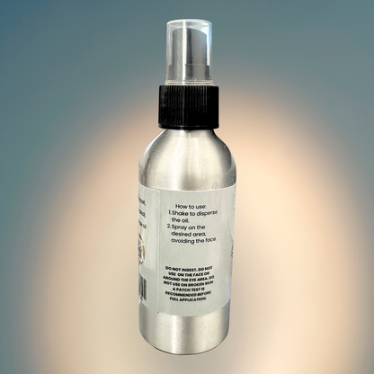 Silver spray bottle with a label on a gradient background