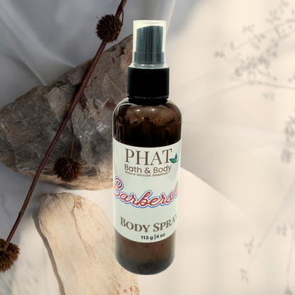 Body spray bottle with 'PHAT Bath & Body' label on a neutral background