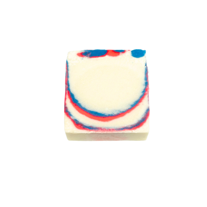 Bar of soap with red and blue swirls on a white background