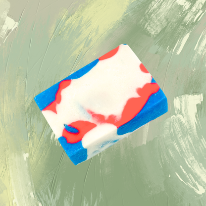 Colorful soap bar with red, white, and blue on a green textured background