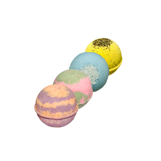 Five colorful bath bombs on a white background